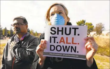  ?? Al Seib Los Angeles Times ?? SUSAN GORMAN-CHANG of the advocacy group Save Porter Ranch protests at a news conference by state lawmakers outside Southern California Gas Co.’s Aliso Canyon facility, the site of a natural gas leak in 2015.