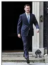  ?? AP/AARON CHOWN ?? British Foreign Minister Jeremy Hunt leaves No. 10 Downing St. in London on Saturday after an emergency session on Iran.