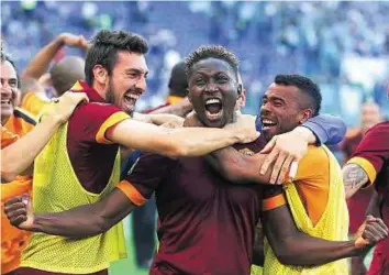  ?? Reuters ?? That’s a winner Roma’s Mapou Yanga-Mbiwa (centre) celebrates with teammates after scoring against Lazio during their Serie A match at the Olympic Stadium in Rome on Monday night.