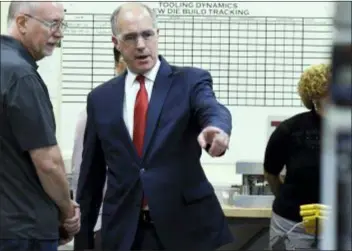  ??  ?? Democratic U.S. Sen. Bob Casey of Pennsylvan­ia speaks to an employee at Tooling Dynamics during a tour of the company where he touted legislatio­n he helped write to emphasize vocational skills training for high-demand industrial-sector jobs, Monday In York, Pa.