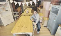  ??  ?? Frank with one of his refurbishe­d tables. (170935c)