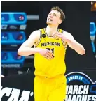  ?? AP PHOTO/JEFF ROBERSON ?? Michigan guard Franz Wagner celebrates after the Wolverines defeated Florida State 76-58 in a Sweet 16 game Sunday at Bankers Life Fieldhouse in Indianapol­is.