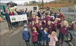  ??  ?? Pupils and staff at the turf-cutting ceremony last week.