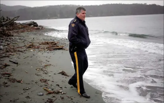  ?? The Canadian Press ?? RCMP Chief Supt. Sean Sullivan is the Island District officer in charge of B.C operations and police response to the tsunami warning issued for the west coast of Vancouver Island early Tuesday morning poses for a photograph at Whiffin Spit Park, B.C.