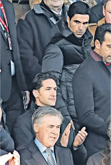  ??  ?? Poised: Carlo Ancelotti (bottom) and Mikel Arteta (top right) watch from the stands at Goodison Park as Duncan Ferguson (below) saw Everton play out a dull 0-0 draw with Arsenal as Mason Holgate and Pierre-Emerick Aubameyang tussle for possession (top left)