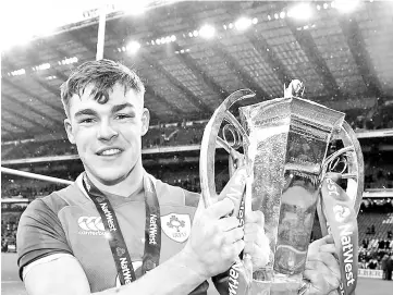  ??  ?? Garry Ringrose celebrates with the 6 Nations trophy.