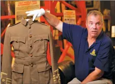  ?? Photos courtesy Galt Museum & Archives ?? Glenn Miller indicates portions of Major A. B. Stafford’s uniform.