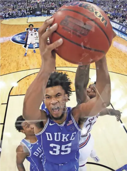  ??  ?? Marvin Bagley III (35) of Duke grabs a rebound against Kansas. STREETER LECKA/GETTY IMAGES