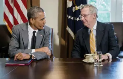 ?? © Andrew Harrer/getty ?? President Barack Obama met Mitch McConnell in 2014.