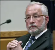  ?? DALE G. YONG/DETROIT NEWS VIA AP; FILE ?? Former Michigan State University dean William Strampel watches court proceeding­s at his preliminar­y exam in East Lansing, Mich.