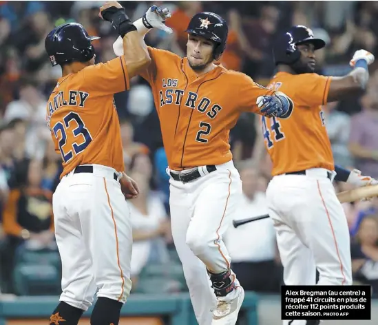  ?? PHOTO AFP ?? Alex Bregman (au centre) a frappé 41 circuits en plus de récolter 112 points produits cette saison.