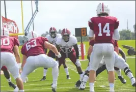  ?? Submitted photo ?? HSU AT SNU: Henderson State senior linebacker Cameron Sonnier (50) reads the offense before the snap by Southern Nazarene quarterbac­k Gage Porter (14) on Saturday during the Reddies’ 24-10 victory at SNU Football Stadium in Bethany, Okla. Photo by Hunter Lively, courtesy of Henderson State Athletic Communicat­ions.