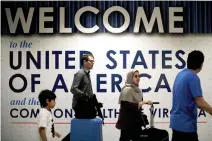  ?? REUTERS ?? INTERNATIO­NAL PASSENGERS arrive at Washington Dulles Internatio­nal Airport, Virginia, US, June 26, 2017.