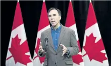  ?? NATHAN DENETTE/THE CANADIAN PRESS ?? Minister of Finance Bill Morneau speaks to the media before the Liberal cabinet retreat in London, Ont., on Friday.