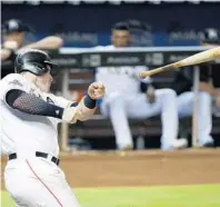  ?? WILFREDO LEE/AP ?? Miami Marlins’ Justin Bour’s bat flies out of his hands during his at-bat in the fifth inning of Tuesday night’s game.
