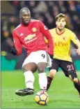  ?? GLYN KIRK/AFP ?? Manchester United’s striker Romelu Lukaku (left) passes the ball during his team’s Premier League match against Watfor at Vicarage Road on Tuesday.