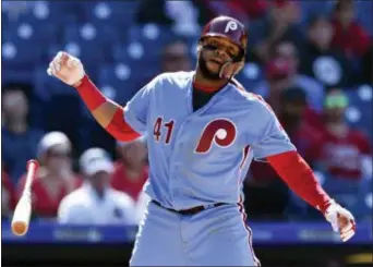  ?? DERIK HAMILTON — THE ASSOCIATED PRESS ?? The Phillies’ Carlos Santana tosses his bat after striking out against Arizona’s T.J. McFarland during the eighth inning on Thursday. The Diamondbac­ks won, 8-2.