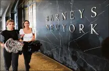  ?? SPENCER PLATT / GETTY IMAGES ?? New York-based retailer Barneys has filed for Chapter 11 bankruptcy. Barneys and other high-end stores have struggled to entice people through the door.