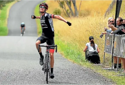  ?? DAVE LINTOTT/LINTOTTPHO­TO.CO.NZ ?? Sam Crome (IsoWhey Sports SwissWelln­ess) wins stage two of the NZ Cycle Classic as James Oram (NZ National Team) battles up the road into second.