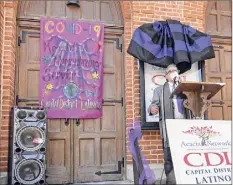  ?? Lori Van Buren / Times Union ?? Dan Irizarry, board Chairman of Capital District Latinos, speaks at an event outside the Capital District Latinos Church to remember the lives lost to COVID-19 on Friday in Albany.