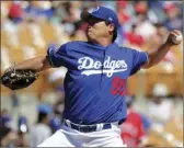  ?? PHOTO ?? Los Angeles Dodgers starting pitcher Hyun-Jin Ryu throws during a spring training baseball game Saturday. AP