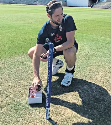  ??  ?? Back in the swing: Chris Woakes gets loose (above and far left) on the Edgbaston outfield before preparing to turn his arm over as he works toward England’s return