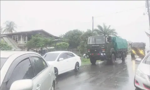  ??  ?? Army trucks with ranks heading to the scene yesterday afternoon