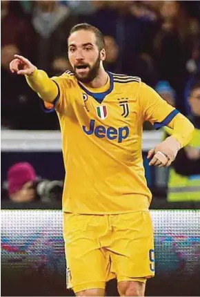  ?? REUTERS PIC ?? Juventus’ Gonzalo Higuain celebrates scoring against Napoli on Friday at Naples.