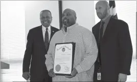  ??  ?? STAFF PHOTOS BY DARWIN WEIGEL Sterling Green of Arness Mechanical Services in Waldorf accepted a Governor’s Citation from Herbert Jordan III, deputy secretary of the Governor’s Office of Minority Affairs (GOMA), left, and Eduardo Hayden, the office’s...