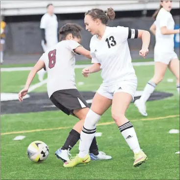  ??  ?? Ridgeland captain Whitney Boehm battles for possession near midfield during last week’s home match against Southeast Whitfield. (Photo by Scott Herpst)