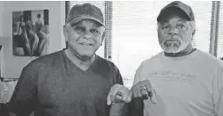  ??  ?? Governor Mitchell (right) and Burton Jordan pose with their rings.