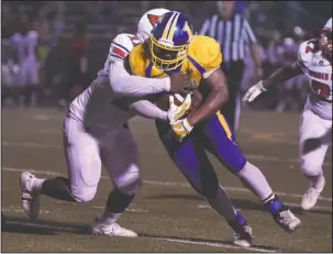  ?? The Sentinel-Record/Mara Kuhn ?? BATTERING RAM: Lakeside running back Dupree Swanson (35) runs the ball as Camden Fairview’s Tyree Holliman (11) defends Friday night at Austin Field. Swanson ran for 229 yards and four touchdowns in Lakeside’s 26-14 win.