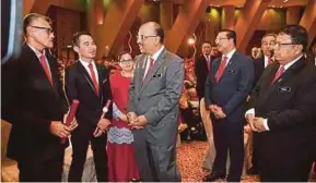  ?? BERNAMA PIC ?? Chief Secretary to the Government Tan Sri Dr Ali Hamsa (centre) with recipients of the Prime Minister’s Department’s Excellent Service Awards in Putrajaya yesterday.