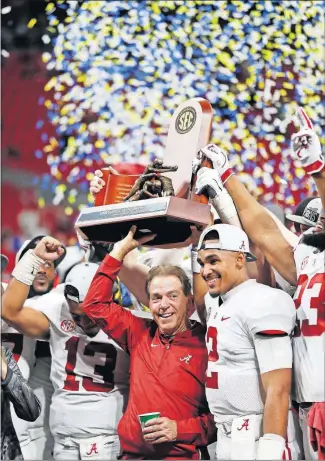  ?? [AP PHOTO] ?? Alabama coach Nick Saban, left, and quarterbac­k Jalen Hurts celebrate a 35-28 victory over Georgia in the SEC Championsh­ip Game last December.