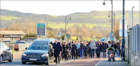  ??  ?? The funeral cortege of Philip Doyle coming up Boghall Road towards St Fergal’s Church in Bray.