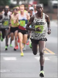  ?? Brian Pounds / Hearst Connecticu­t Media ?? Defending champion Leonard Korir breaks away from the lead pack on his way to winning his third Faxon Law New Haven Road Race in New Haven in 2019.