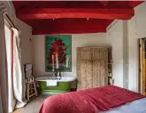  ?? ?? Top: bright candy-stripe umbrellas form a cheerful welcoming party. Above: sink into the roll-top bath