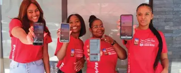  ?? Photo: Contribute­d ?? Enhanced experience… Bank Windhoek’s Capricorn branch staff members showing off the Bank’s Mobile App.