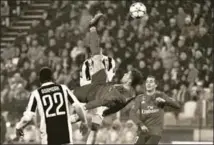  ?? AFP ?? Cristiano Ronaldo (C) scores during the UEFA Champions League quarterfin­al match between Juventus and Real Madrid, Turin, Italy, April 3