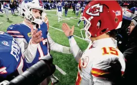  ?? Jeffrey T. Barnes/Associated Press ?? Buffalo Bills quarterbac­k Josh Allen (17) greets Kansas City Chiefs quarterbac­k Patrick Mahomes after playing in an AFC divisional playoff game Sunday in Orchard Park, New York.