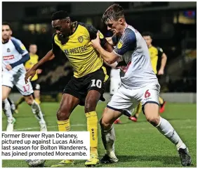  ??  ?? Former Brewer Ryan Delaney, pictured up against Lucas Akins last season for Bolton Wanderers, has joined promoted Morecambe.