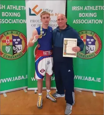  ??  ?? Irish champion Matthew Tyndall of Arklow Boxing Club with coach and dad Matthew Snr.