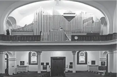  ?? ?? Plastic is draped over the Gift Chapel’s organ to prevent water damage from a hole in the 115-year-old building’s ceiling. The custom-made organ was installed in 1969.