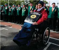  ?? PHOTOS: PA ?? Show of force: Retired Sergeant Major Noel O’Callaghan with his granddaugh­ter Aleesha Penrose (9), top, at the parade for respect at Merrion Square, Dublin, far left. Left: Patricia O’Loughlin, who’s daughter is a member of the Defence Forces.