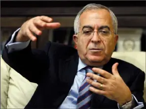  ?? AP/MAJDI MOHAMMED ?? Palestinia­n Prime Minister Salam Fayyad speaks with The Associated Press on Sunday in the West Bank city of Ramallah.