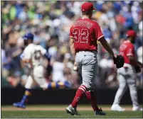  ?? JOHN FROSCHAUER – THE ASSOCIATED PRESS ?? Jesse Winker of the Mariners rounds the bases after hitting a grand slam against Angels starter Tucker Davidson during the third inning of Sunday’s game in Seattle.