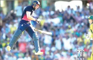  ?? GLENN NICHOLLS/AFP ?? England batsman Jos Buttler celebrates reaching his century in the third ODI against Australia in Sydney yesterday.