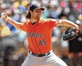  ?? EZRA SHAW/GETTY IMAGES ?? Gerrit Cole, who is pitching to a 1.43 ERA with a league-leading 86 strikeouts in 56⅔ innings, has been quite the steal for the Astros.