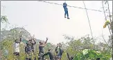  ?? ANI ?? A child being rescued in Trikut Hills in Deoghar on Monday.