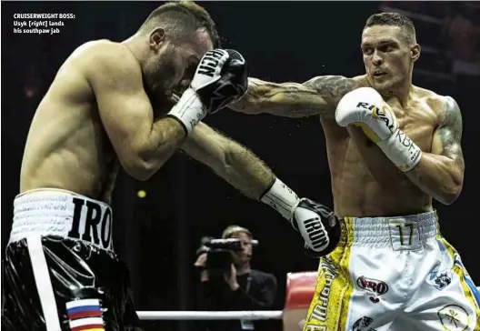  ?? Photos: WORLD BOXING SUPER SERIES ?? CRUISERWEI­GHT BOSS: Usyk [right] lands his southpaw jab